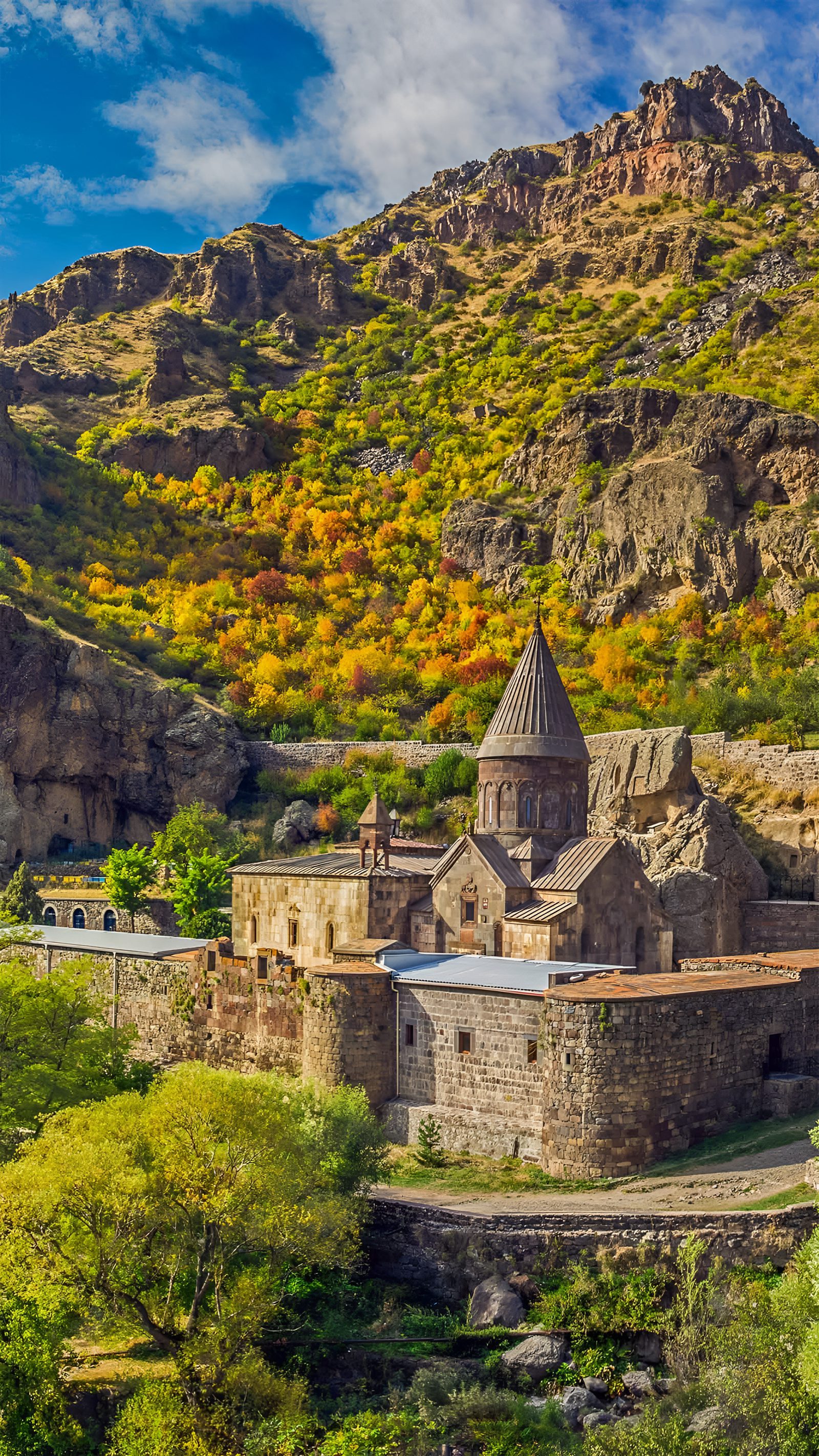 Geghard Monastery among autumn hills