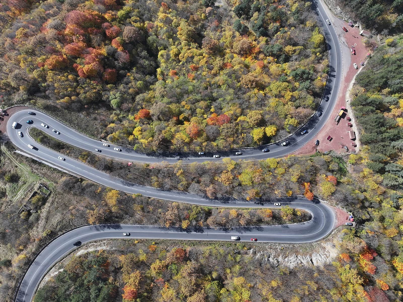M4 highway winding through autumn forest near Dilijan