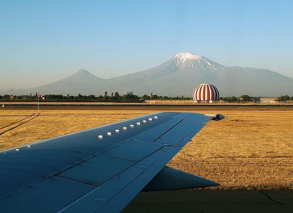 Aircraft wing on the airfield of Zvartnots Airport with Mount Ararat on the horizon